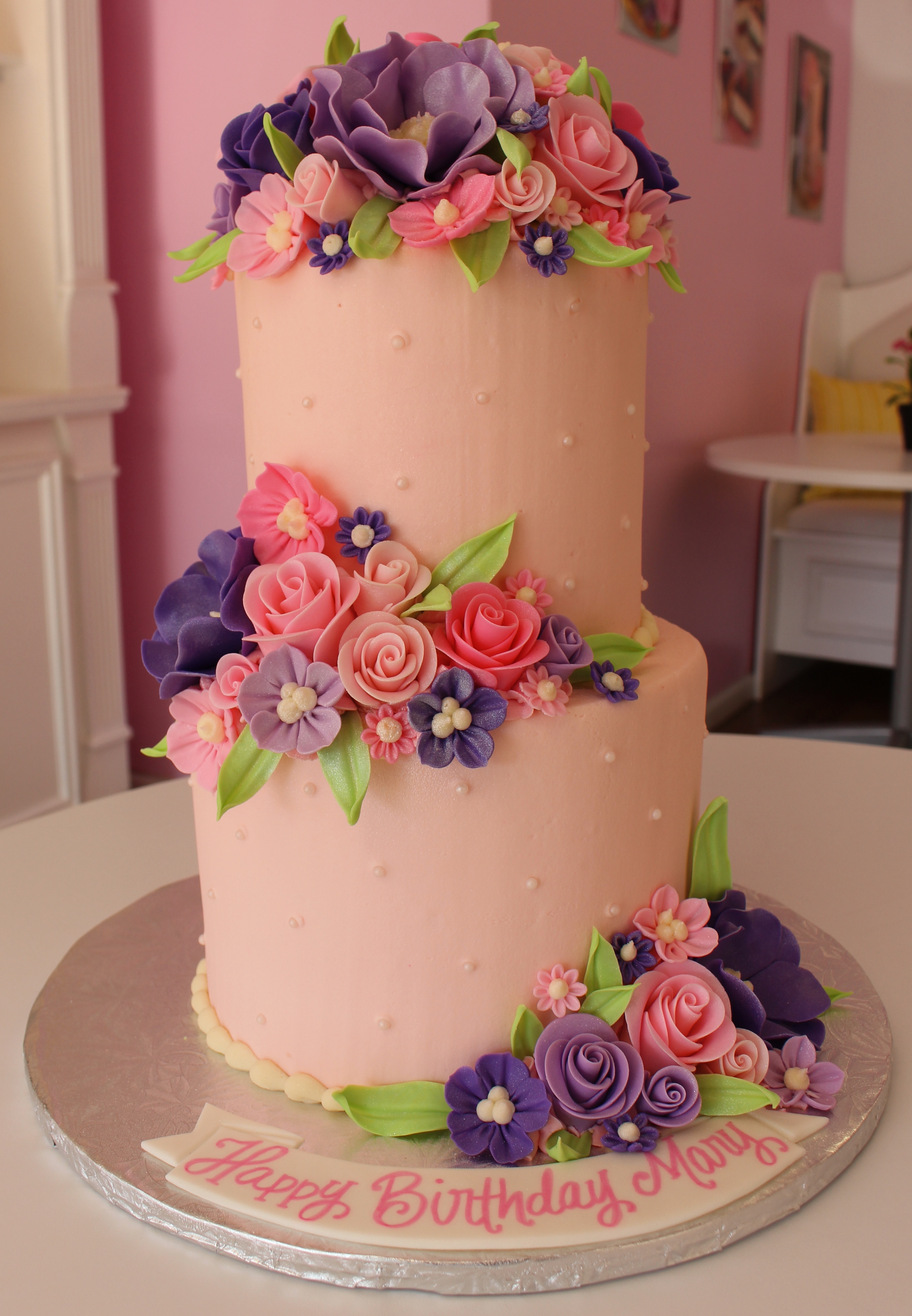 Light Pink Elegant Cake with Sugar Pearls and Fondant Flowers and Leaves